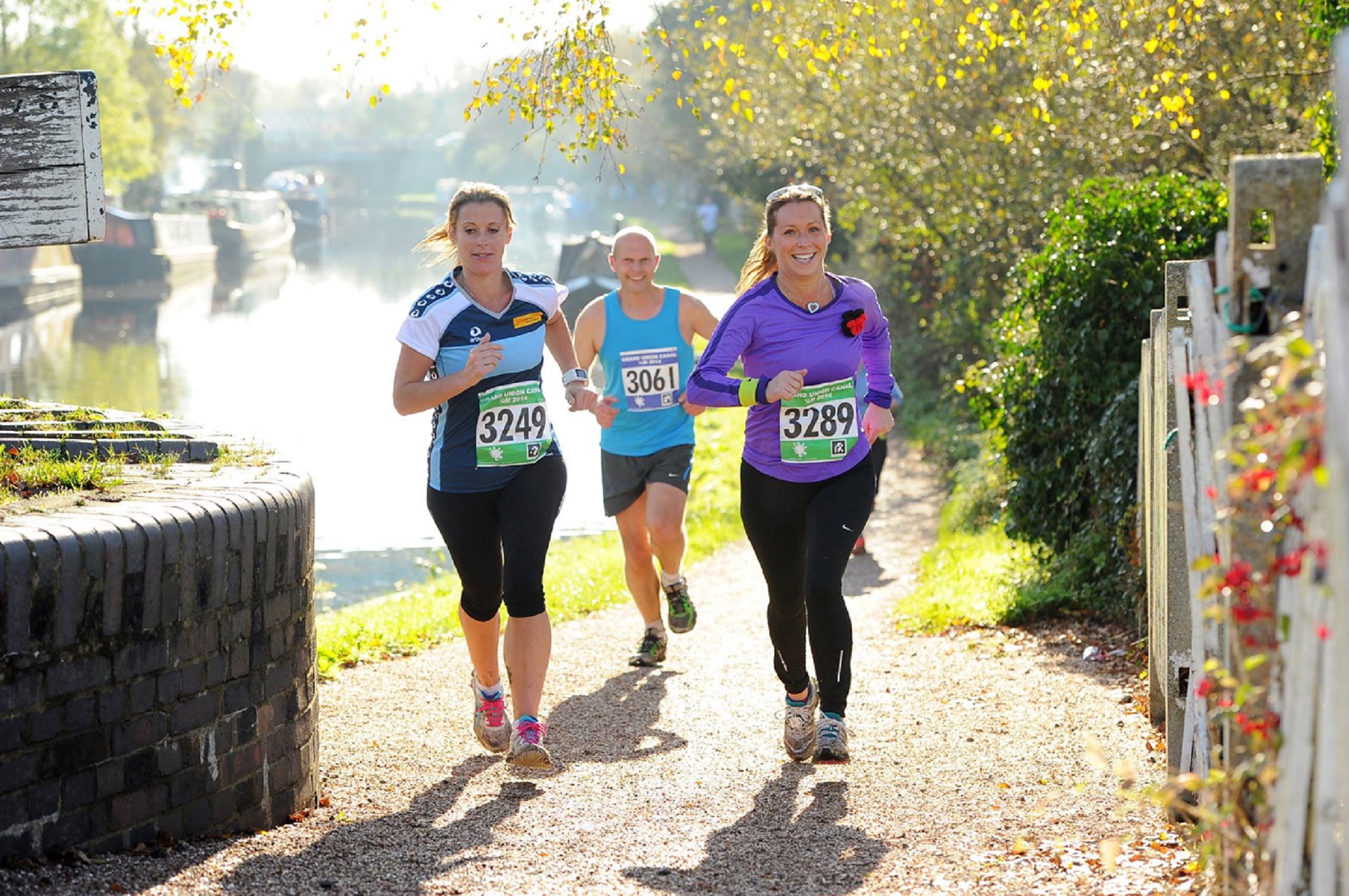 Three runners are jogging towards the camera.
