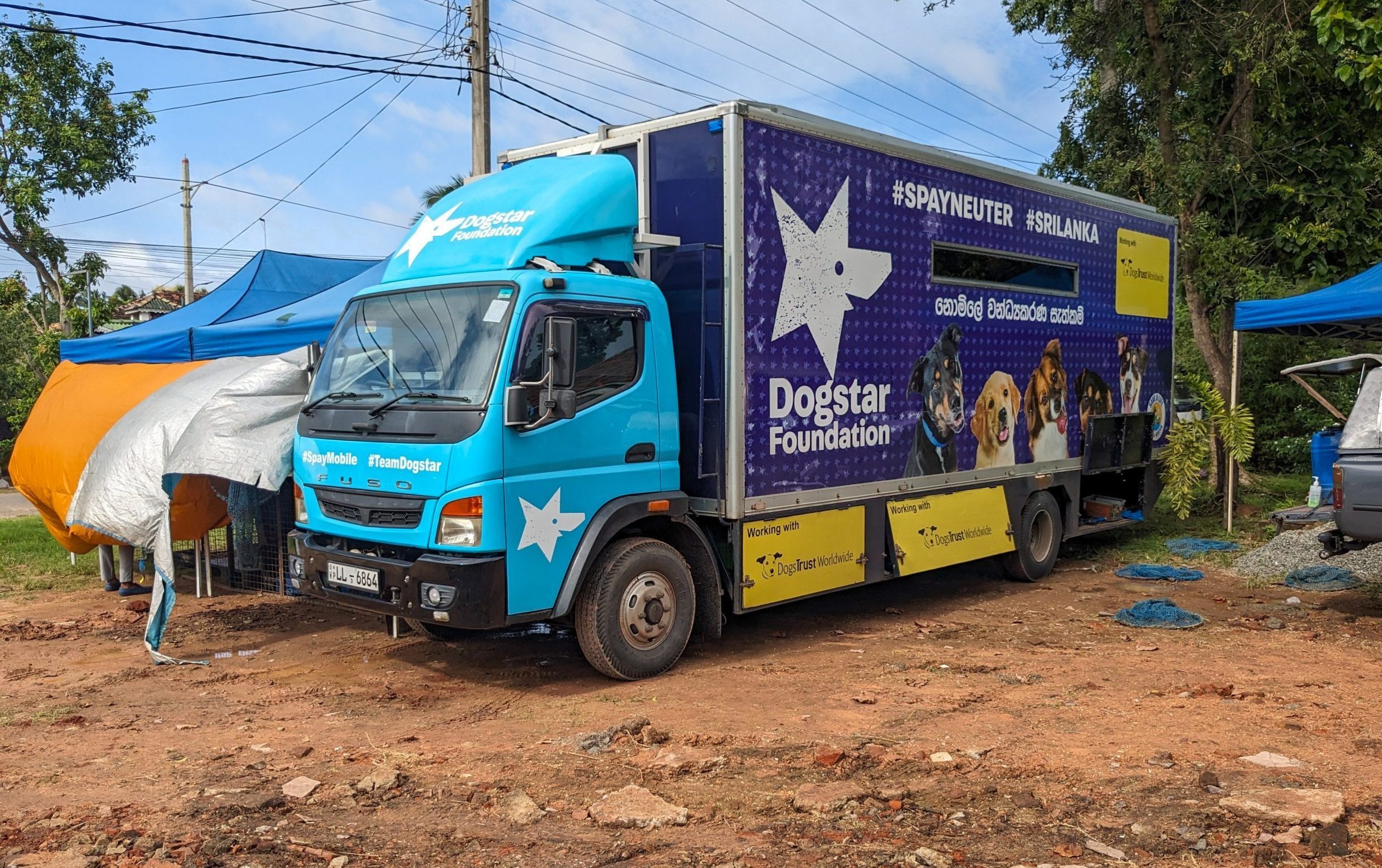 Side view of the blue Dogstar spay/neuter truck.